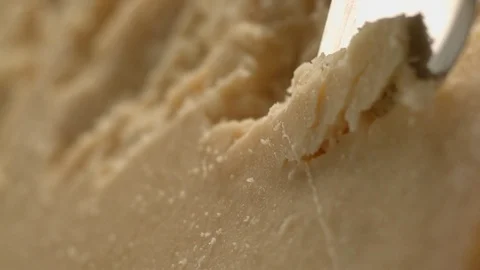 A sharp knife shreds hard cheese into small pieces. Stock Footage 83724464