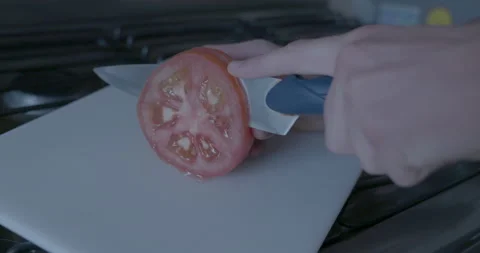 Sharp Knife slices Tomato Stock Footage 153815619