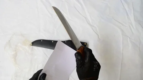 Sharp knife, tes on paper Stock Footage 120425845