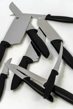 Sharp large kitchen knife on a dark surface, white background mexico Foto stock