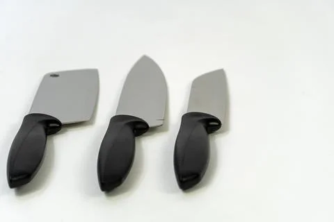 Sharp large kitchen knife on a dark surface, white background mexico Foto stock