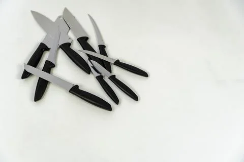 Sharp large kitchen knife on a dark surface, white background mexico Stock Photos