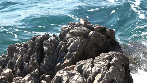 Sharp limestone rocks against the sea water 動画素材 342394094