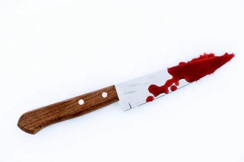 Sharp metal kitchen knife edge used as a violent murder weapon with blood dro Stock Photos