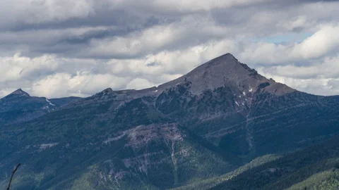 Sharp mountain peak under moving clouds Stock-Footage 167245739