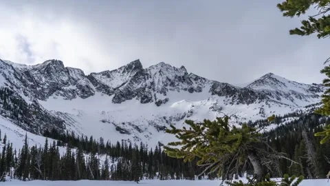 Sharp mountain peaks with clouds timelapse Stock Footage 310536399