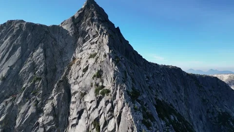 Sharp mountain ridge to the summit, drone shot Stock Footage 289575628