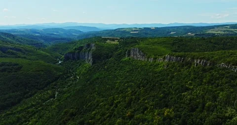 Sharp Mountain Ridges Overlooking Natural Quarry Covered In Green Forests Aerial Stock-Footage 300442824