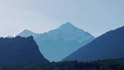 Sharp mountain top covered with snow. the sun is shining Stock Footage 94779295