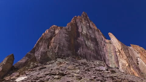 Sharp Mountain Wall Against Blue Sky Drone View Stock Footage 311051051