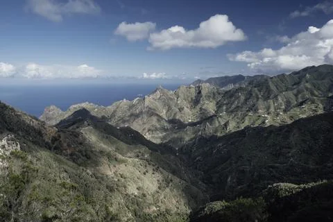 Sharp mountains under light and shadow Stock Photos