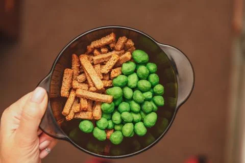 Sharp nuts with wasabi. Crackers with spices. Beer snacks. Stock Photos