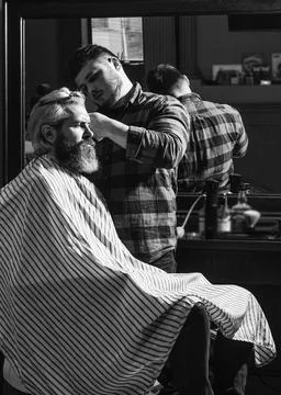 Sharp object near face and squirming distracts person holding it. Donate hair Stock Photos