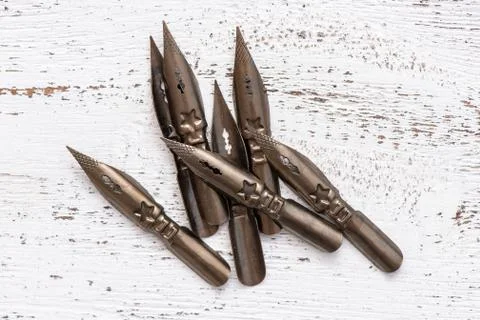 Sharp pen for calligraphy. close-up. retro style Stock Photos