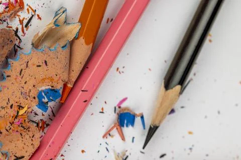 Sharp pencil of different colors on paper close-up Stock Photos