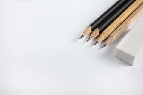 Sharp pencil with eraser on blank paper Stock Photos