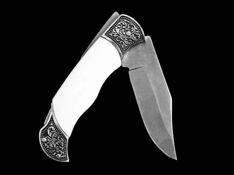 Sharp pocketknife isolated on a black background Stockfoto's
