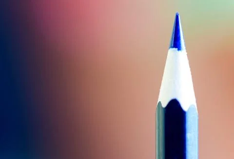 Sharp point of a blue pencil with a defocused background and copy space area  Stock Photos