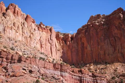 The sharp pointed red rock walls in the Capitol Reef National Park Stock Photos