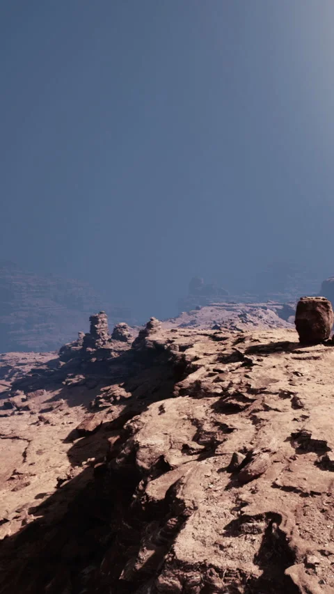 Sharp rocks and blue sky in a remote desert landscape at midday Stock Footage 339041376