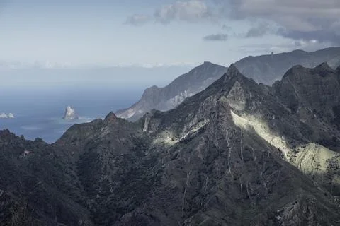 Sharp rocks and steep mountain slopes Stock Photos