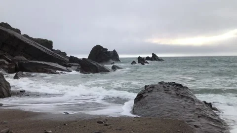 Sharp rocks at the Atlantic Ocean and waves in England Stock Footage 167653788
