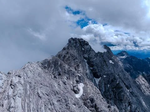 Sharp Rocky Peak with Clouds in High Alpine Landscape Stock Photos
