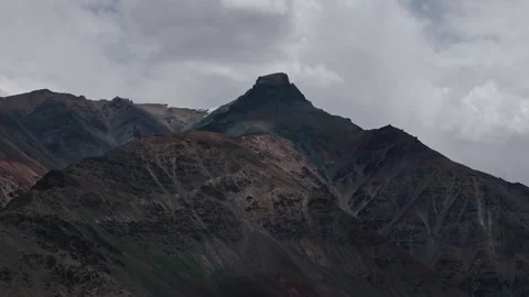 Sharp rocky peak in remote Ladakh region under overcast sky Stock Footage 311554423