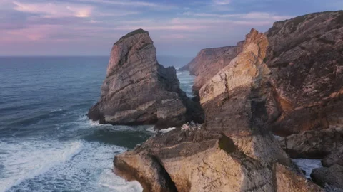Sharp scarps between cliffs and many rocks brought by the ocean as seen from top 스톡 동영상 162294267