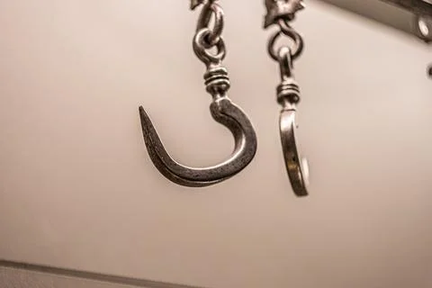 Sharp scary hook on the chain abstraction Stock Photos