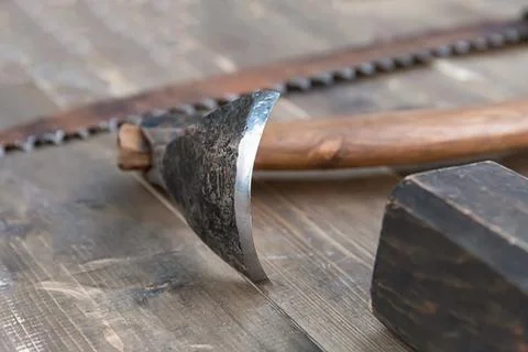 Sharp scraper ax for cutting the bark of a tree close-up on the background of Stock Photos