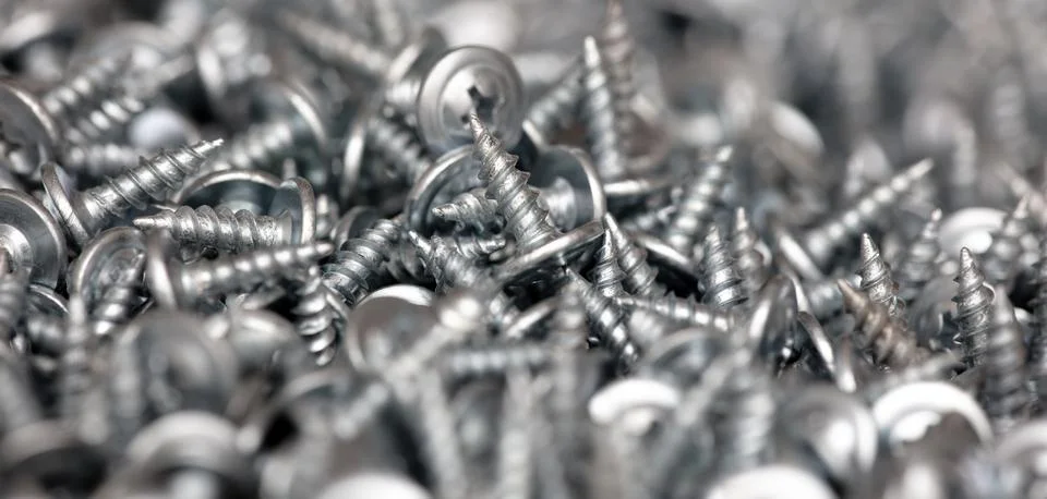 Sharp screws as abstract background Stock Photos