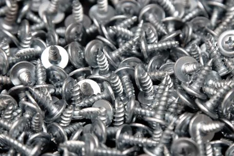 Sharp screws as abstract background Stock Photos