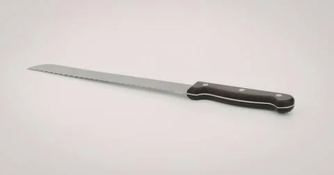 Sharp serrated bread knife with black handle Photos