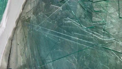 Sharp sheet glass waste in white big bags Stock Footage 237174579