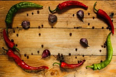 Sharp spices on a wooden surface Stock Photos