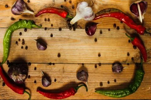 Sharp spices on a wooden surface Stock Photos