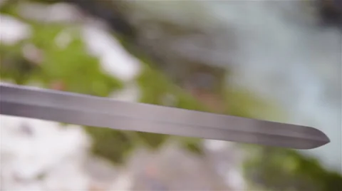 Sharp sword in hand panning over close up 4K Stock Footage 59827916