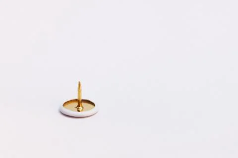 A sharp thumbtack on white background 库存照片