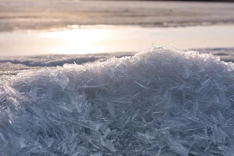Sharp transparent ice crystal formations creating intricate geometric patte.. Stock Photos