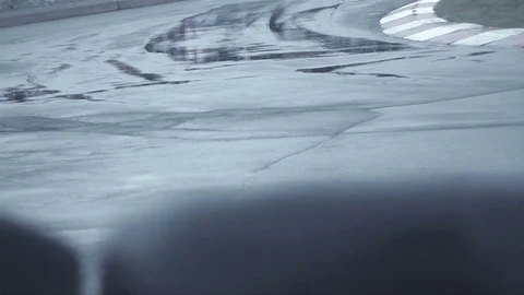 Sharp turn of black bike in wet conditions Stock Footage 70326017