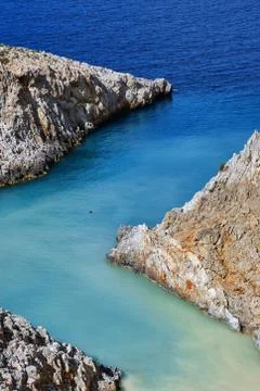 Sharp Z-shaped bay, cliffs, sea shores, crystal azure water. Natural geometry Stock Photos