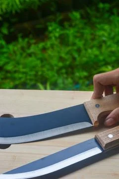 Sharp...do not touch! Chef's kitchen knife isolated on white background Stock Photos