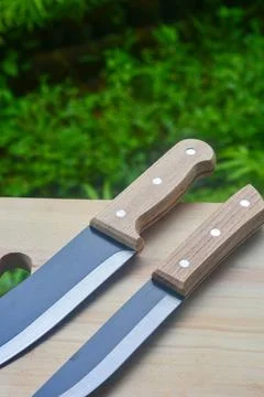 Sharp...do not touch! Chef's kitchen knife isolated on white background Stock Photos