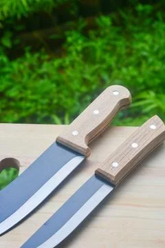 Sharp...do not touch! Chef's kitchen knife isolated on white background Stock Photos