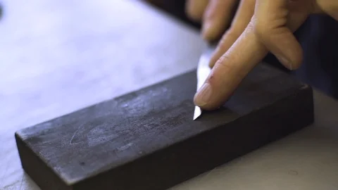 Sharpen the blade Stock Footage 106420780