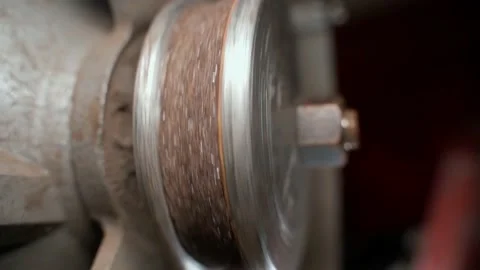Sharpened abrasive wheel on a grinding machine close-up. Stopping the grinding Stock Footage 229947514