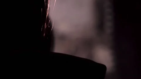 Sharpened close-up in the dark with bright sparks. copy space Stock Footage 140108679