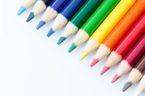 Sharpened colored pencils on a white background. Stock Photos