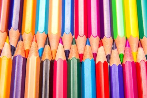 Sharpened multicolored pencils in a grid pattern. Suitable for art supplies.. Stock Photos